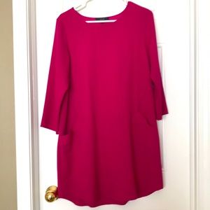 Fuschia tunic or dress with pockets.